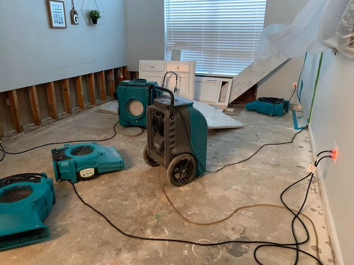 Dehumidifier in flood-cut room for Water Damage Restoration in Quincy